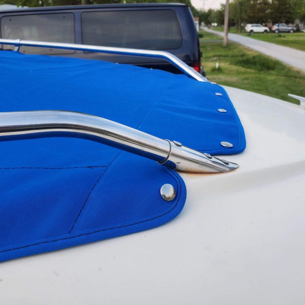 Cockpit cover and open bow cover in Sunbrella Pacific Blue.